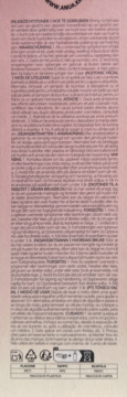 Tył opakowania toniku Anua Peach 77%, jasnoróżowy, z drobnym, wielojęzycznym tekstem i symbolami recyklingu.