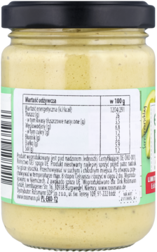 Tył szklanego słoika z żółtym kremem bananowym, widoczna zielono-biała etykieta z wartościami odżywczymi.