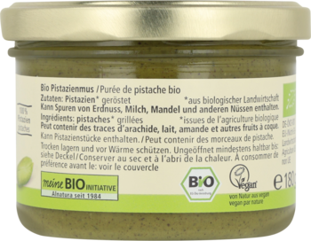 Tył zielonego słoika Alnatura Bio Pistazienmus. Widoczna etykieta ze składem z prażonych pistacji i certyfikatem BIO.