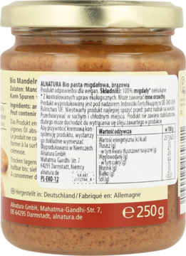 Tył szklanego słoika z Alnatura Bio pastą migdałową 100%, brązowa etykieta z opisem i wartościami odżywczymi.