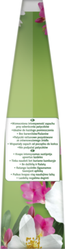 Zielona stożkowa butelka z listą cech produktu na białej etykiecie i grafiką różowo-białych kwiatów.