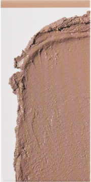 Zbliżenie na teksturowany swatch kremowego bronzera do twarzy, o pielęgnacyjnej formule w ziemistym brązie.