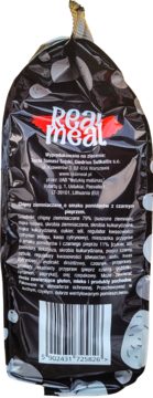 Tył czarnego opakowania chipsów Real Meal o smaku pomidora z czarnym pieprzem, widoczna lista składników i kod kreskowy.