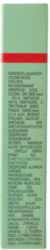 Detailed side view of light green cosmetic packaging with red stripe, featuring a list of ingredients.