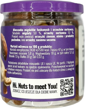 Tył przezroczystego słoika z mieszanką migdałów i nerkowców. Widoczna fioletowa etykieta z napisami po polsku.