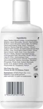 Tył białej butelki szamponu Nizoral Daily Care, widoczna lista składników, dystrybutor i kod EAN.