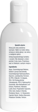 Tył białej butelki szamponu Nizoral Daily Care z etykietą zawierającą instrukcję i składniki.