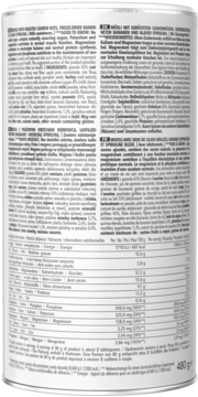 Tył opakowania musli z orzechami, spiruliną i owocami, szczegółowa tabela wartości odżywczych i składników.