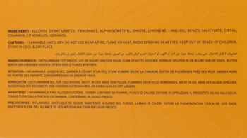 Tył etykiety perfum Mango Punch z listą składników i ostrzeżeniami w wielu językach, na pomarańczowym tle.