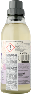 Tył butelki płynu do prania Frosch Colorwaschmittel, 720ml, z niemiecką etykietą i symbolem ostrzegawczym.