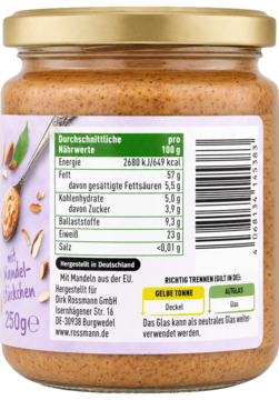 Tył szklanego słoika ekologicznego musu migdałowego z kawałkami 250g z tabelą wartości odżywczych.
