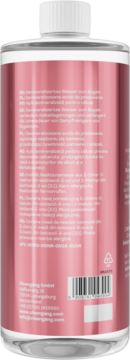 IRONIQ woda demineralizowana do żelazka Blossom Sky, tył różowej butelki, widoczny kod kreskowy i tekst.