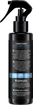 Tył czarnej butelki odżywki w sprayu, z białym tekstem "CONDITIONER TRUE BALANCE OPERATOR" i niebieskim paskiem "DERMATOLOGICALLY TESTED".