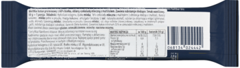 Zbliżenie na tył ciemnego opakowania produktu spożywczego z listą składników, wartościami odżywczymi i kodem.