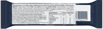 Tył ciemnego opakowania produktu spożywczego z białą etykietą, zawierającą wartości odżywcze, składniki, kod kreskowy.