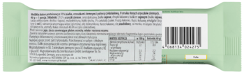 Tył opakowania batonika w jasnozielonej folii, z widoczną tabelą wartości odżywczych i kodem kreskowym.