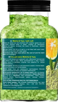 Tył szklanego opakowania soli do kąpieli Matcha & Yuzu, z zielonymi kryształami i etykietą z yuzu i matchą.
