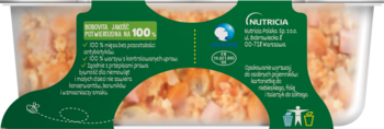 Gotowy obiadek Nutricia z dużymi kawałkami dla niemowląt, zielona etykieta, widoczne warzywa i mięso w pojemniku.