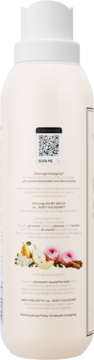 Tył płynu do płukania tkanin Juicy & Elegant z QR kodem, gruszką, piwonią i cynamonem, beżowa butelka.