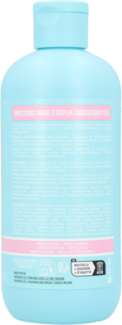 Tył szamponu Hairburst Longer Stronger Hair. Jasnoniebieska butelka z różowymi etykietami z opisem i składem.