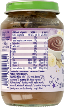 Tył szklanego słoiczka kaszki mlecznej manny z bananami i kakao dla niemowląt, z etykietą i tabelą wartości odżywczych.