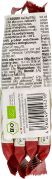 Tył białego opakowania wegańskich batonów Bio zbożowo-owocowych, banan, winogrono, aronia, z etykietą.