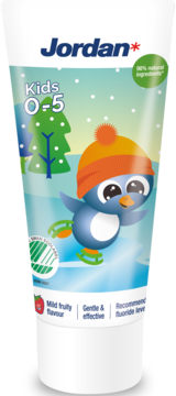 Jordan Kids 0-5 Toothpaste, white tube with blue penguin, snow & trees. Mild fruity, gentle, fluoride. Front view.