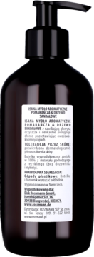 Tył ciemnobrązowej butelki Isana mydła w płynie Pomarańcza & Drzewo Sandałowe z czarną pompką.