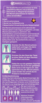 Tył fioletowego opakowania kubeczka menstruacyjnego Facelle z instrukcjami użycia i tabelą rozmiarów, po niemiecku.