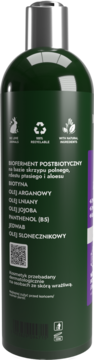 Tył ciemnozielonej butelki wzmacniającego szamponu Mysterium z biotyną i biofermentem. Widać składniki i ikony.