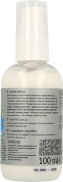 Tył białej butelki serum do rąk z pompką, z polską etykietą zawierającą opis i składniki produktu.