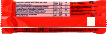 Tył opakowania czekolady Daim 28g, mleczna z karmelem migdałowym. Widoczna biała tabela wartości odżywczych na czerwonym tle.