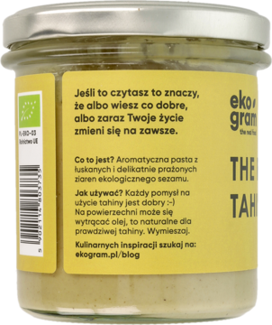 Tył szklanego słoika tahini Ekogram z żółtą etykietą i polskim opisem aromatycznej pasty sezamowej.