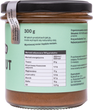 Tył szklanego słoika organicznej pasty z orzechów laskowych 300g, zielona etykieta z tabelą wartości odżywczych.