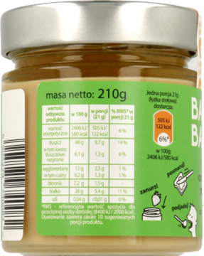 Tył szklanego słoika z naturalnym kremem orzechowym Basia Basia. Widoczna zielona etykieta z tabelą wartości odżywczych i masą netto 210g.