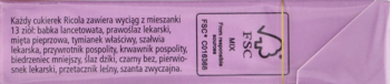 Tył fioletowego opakowania szwajcarskich cukierków ziołowych bez cukru, z informacjami o produkcie.