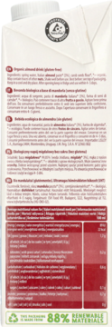 Tył opakowania ekologicznego napoju migdałowego bez cukru, z etykietami w wielu językach i tabelą odżywczą.