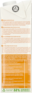 Biały tył kartonu organicznego napoju owsianego z kakao, z listą składników i tabelą wartości odżywczych.
