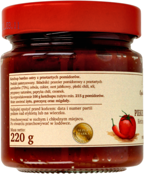 Tył słoika superostrego ketchupu pomidorowego 220g z etykietą informacyjną, rysunkiem chili i pomidora.