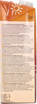 Tył pomarańczowego kartonu Natumi napoju owsiano-migdałowego 1l bez dodatku cukrów, z listą składników.