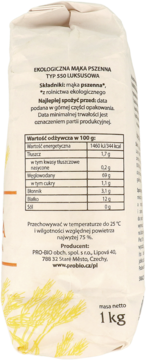 Tył beżowego opakowania mąki pszennej ekologicznej Bioharmonie typ 550 luksusowa 1 kg, z tabelą wartości odżywczych.