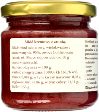 Miód kremowy z aronią w słoiku, widok z tyłu opakowania z etykietą i składem produktu.