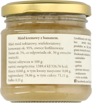 Tył szklanego słoika z kremowym miodem bananowym. Widoczne złote wieczko i biała etykieta ze składem.