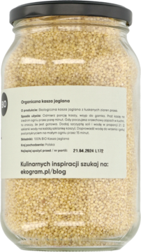 Tył szklanego słoika z organiczną kaszą jaglaną BIO. Widoczna biała etykieta z polskim opisem i danymi producenta.