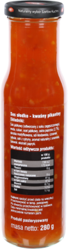 Tył szklanej butelki z sosem słodko-kwaśnym pikantnym o masie 280g, widoczna etykieta z tabelą wartości odżywczych.