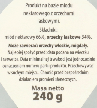 Zbliżenie na etykietę miodu z orzechami laskowymi, pokazujące skład: 66% miodu, 34% orzechów i masę netto 240g.