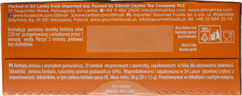 Tył pomarańczowego opakowania herbaty Dilmah Premium Pomarańcza. Widoczne instrukcje parzenia i skład.