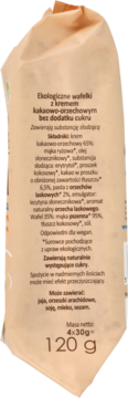 Bok brązowego opakowania organicznych wafli kakaowo-orzechowych bez cukru, z etykietą składników i wagą netto.