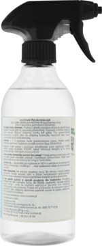 Tył przezroczystej butelki naturalnego płynu do mycia szyb z czarnym atomizerem. Widoczna etykieta z informacjami o składzie.