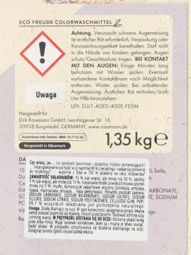 Tył opakowania proszku Eco Freude Colorwaschmittel 1,35 kg. Widoczne ostrzeżenie: podrażnia oczy.